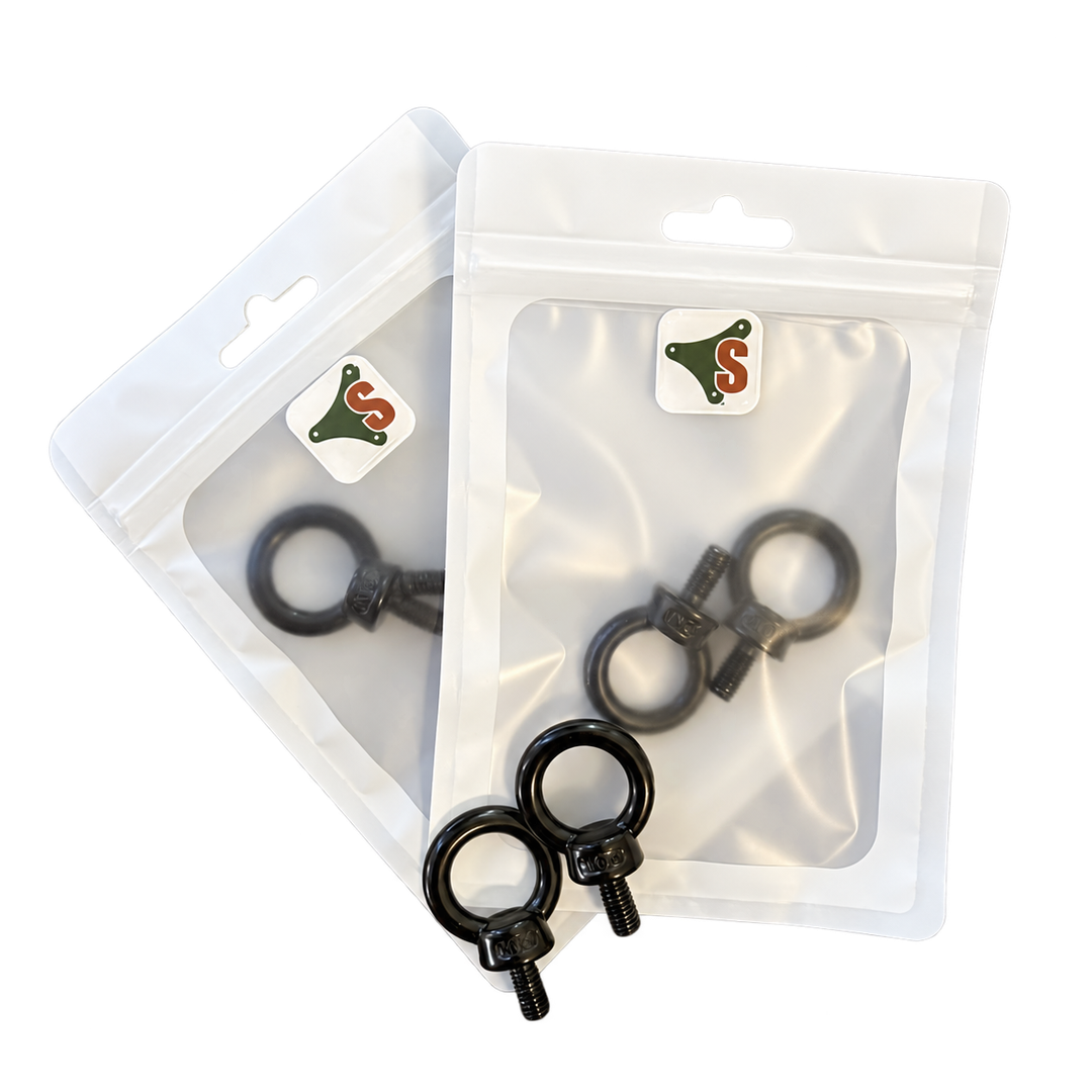 SheltaFlex Ringschraube M6 Set mit zwei Verpackungen und zwei schwarzen Ringschrauben, Ansicht links.