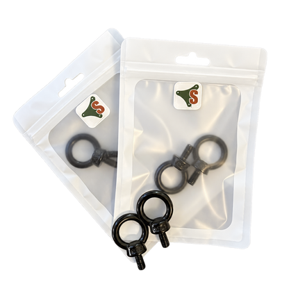 SheltaFlex Ringschraube M6 Set mit zwei Verpackungen und zwei schwarzen Ringschrauben, Ansicht links.